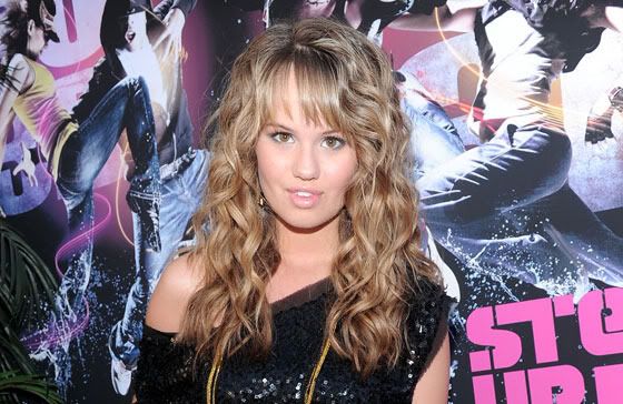 Debby's hairstyle looks like something straight from the 80s 