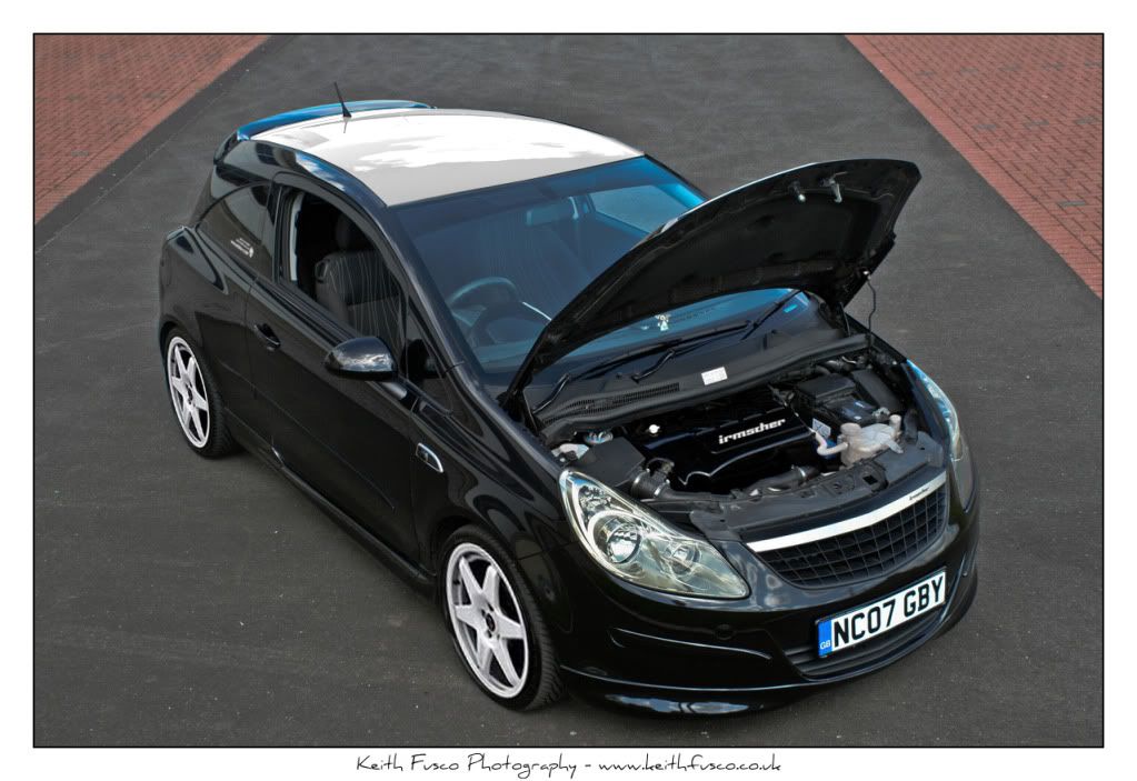 black car with a white roof